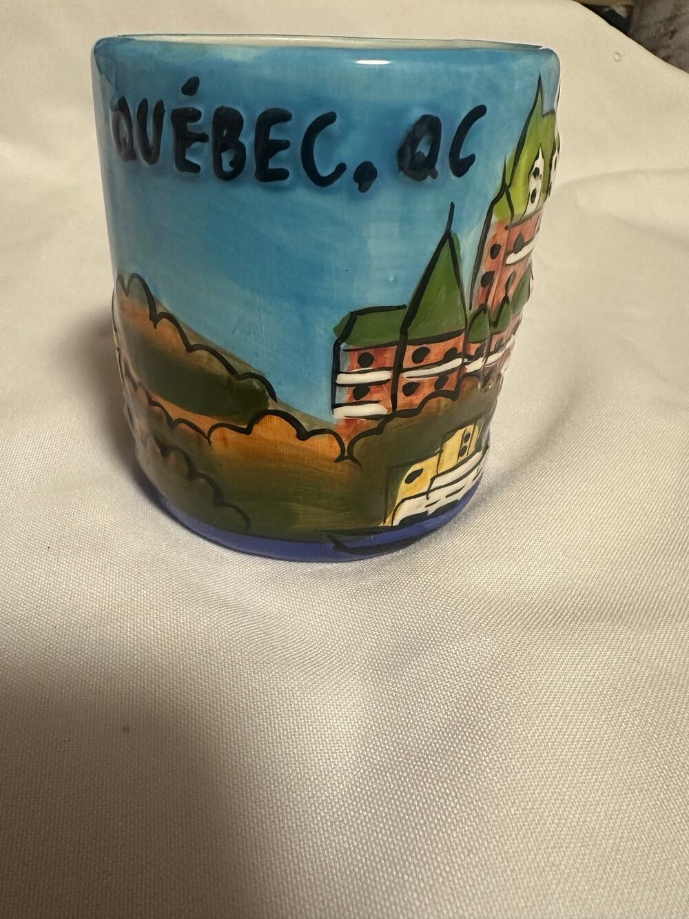 Quebec colorful souvenir coffee mug by JC Richard Inc.